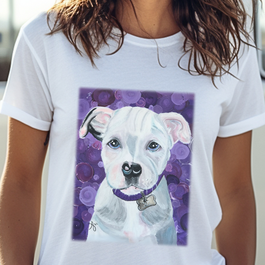 Unisex T-Shirt with reproduction of the painting Portrait of a Pit Bull by Mama Mosaic Artworks. A beautiful white and gray Pit Bull sits face forward. Her ears curl slightly forward, with a mottled background of shades of purple. Pit Bull Pitbull Pittbull Pittie. Dog Lover Animal Lover Rescue Dog whimsical whimsy aesthetic.  Inclusive Sizes 2XL 3XL 4XL 5XL.